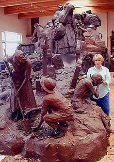 GLENNA GOODACRE WORKING ON THE CLAY MODEL OF THE IRISH MEMORIAL